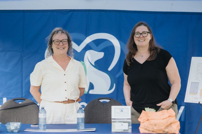 Two volunteers at the Humane Society of Greater Niagara tent